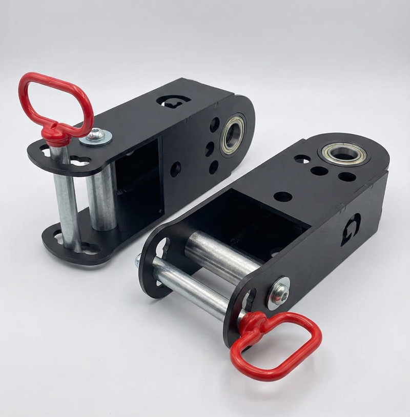 Pair of GymPin jammer arm multi-directional adapters with powder-coated black steel body, dual bushings, and red locking handles for expanding jammer arm exercise range.