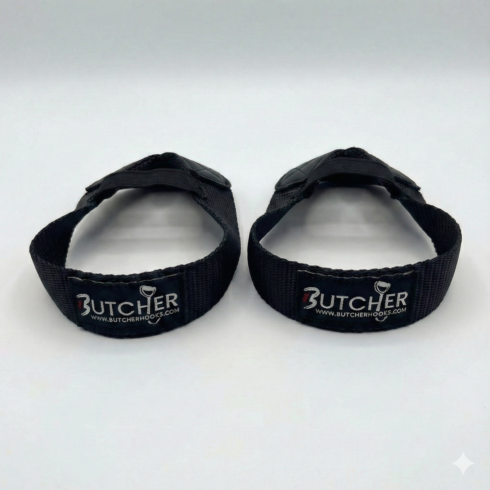 GymPin Butcher Hooks pair in black — heavy-duty weightlifting wrist straps with reinforced stitching and padded grip, designed for deadlifts, rows and strength training.