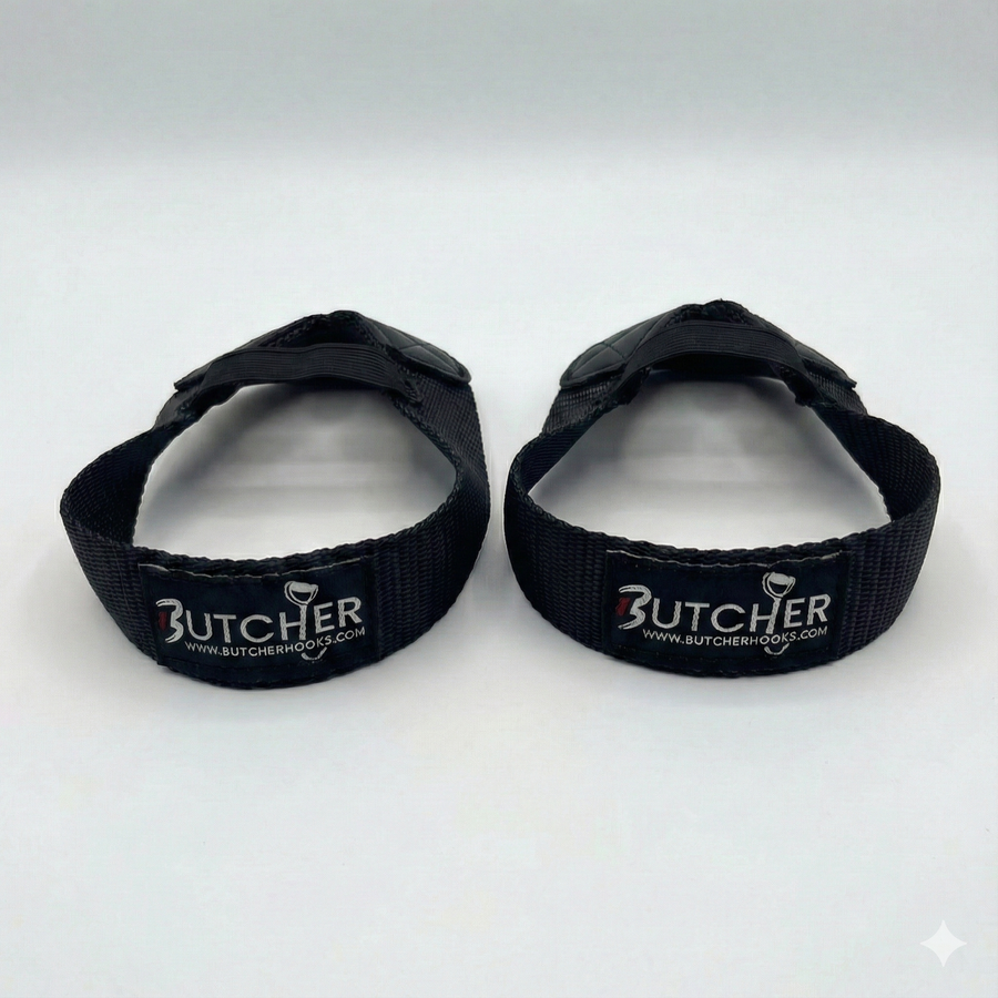 GymPin Butcher Hooks pair in black — heavy-duty weightlifting wrist straps with reinforced stitching and padded grip, designed for deadlifts, rows and strength training.