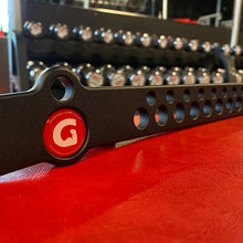 A close-up of a black GymPin D Handle Bar with a red logo sticker, showing the textured black powder coat finish.