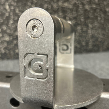 Metal bracket with a logo on a textured gray background