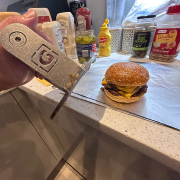  A recently smashed double cheeseburger made with the GymPin Burger Patty Press
