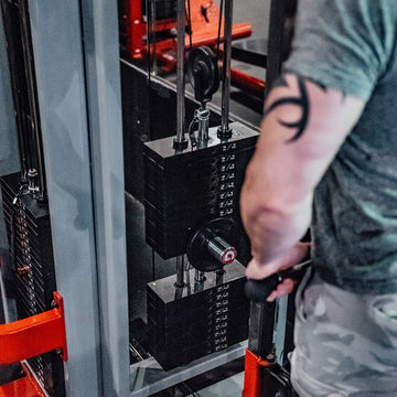 Mini GymPin in a cable stack in a gym being used by a person working out.