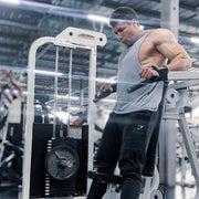The Original GymPin enhances workouts for strength training using a cable machine with Olympic plates.