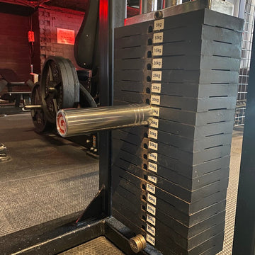 The KingPin extra-long 10mm GymPin weight stack extender for loading Olympic plates onto compatible cable machines.