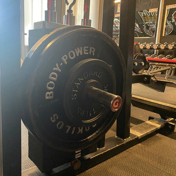 The KingPin extra-long 10mm GymPin weight stack extender for loading Olympic plates onto compatible cable machines.
