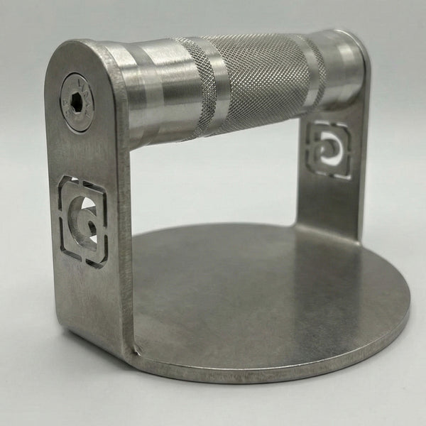 GymPin stainless steel burger press with a knurled handle and laser-cut GymPin logos, designed to shape uniform burger patties.