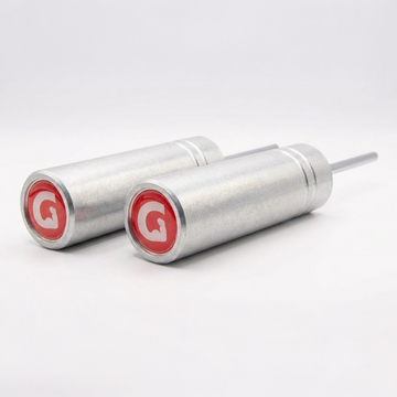 Two silver GymPins in Raw with red circular labels featuring a white 'G' on a light gray background.