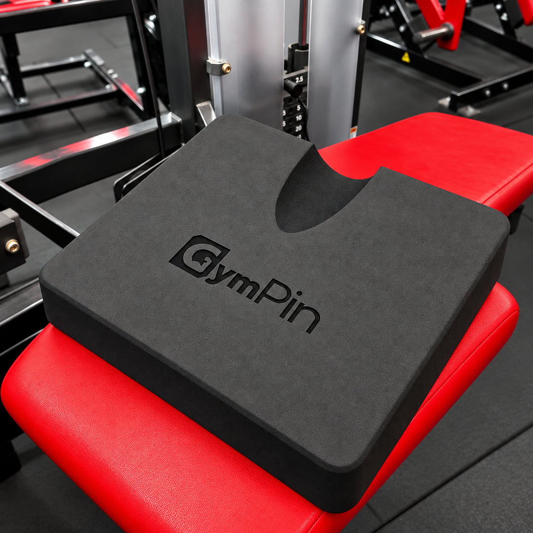 GymPin hamstring pad positioned on a leg curl machine bench