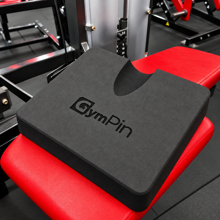 GymPin hamstring pad positioned on a leg curl machine bench