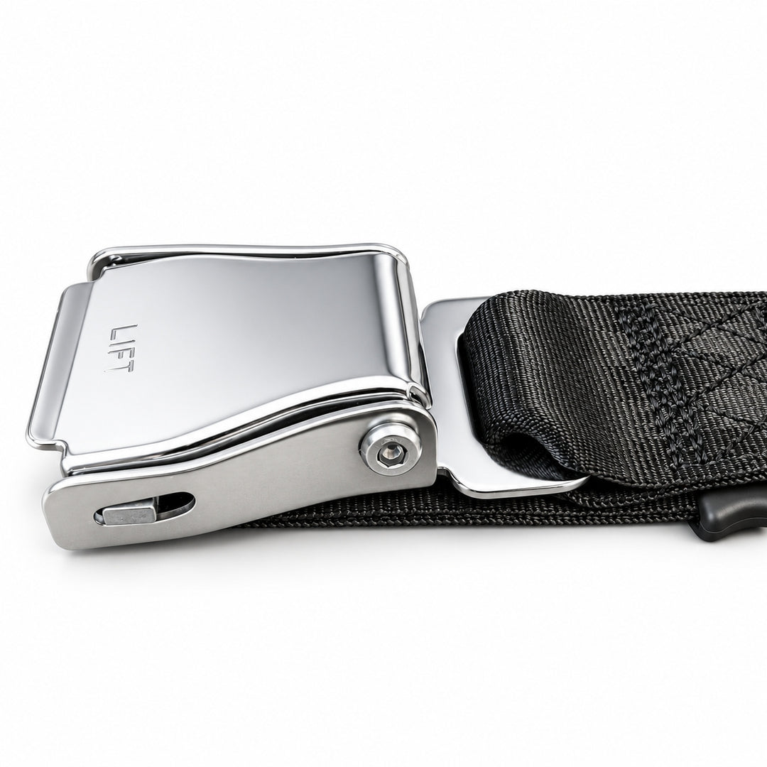 Close-up of the GymPin Seat Belt chrome buckle and attached black webbing strap.