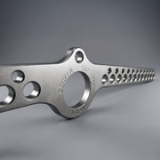 Metallic tool with 'GymPin' branding on a gray background