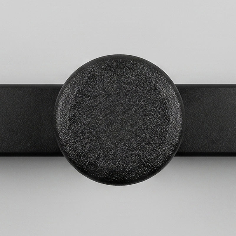 Black belt with a round, textured buckle on a light gray background Hyper Loader