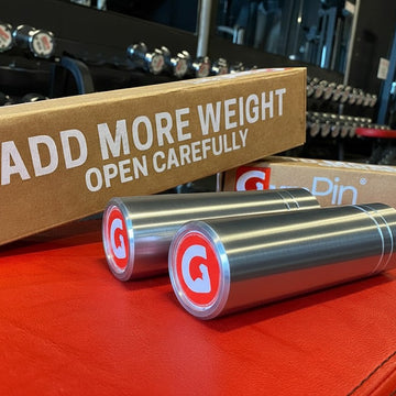 The Original GymPin displayed with packaging to add more weight for enhanced workouts.