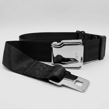 Black seat belt with silver buckle on a light gray background